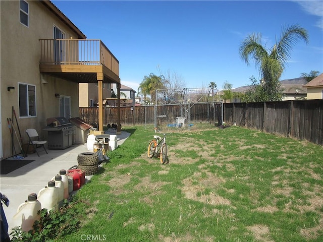 view of yard with a patio area, area for grilling, and a fenced backyard