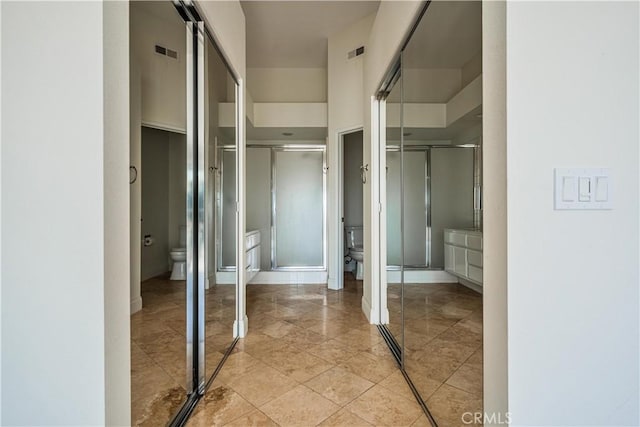 full bathroom featuring visible vents, a shower stall, and toilet