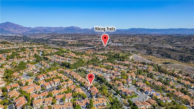 birds eye view of property with a residential view and a mountain view