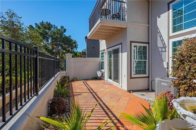 view of patio featuring central AC unit and a fenced backyard