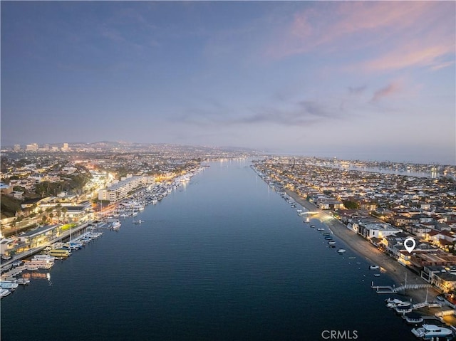 aerial view at dusk with a water view