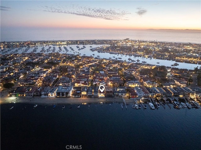 aerial view at dusk with a water view