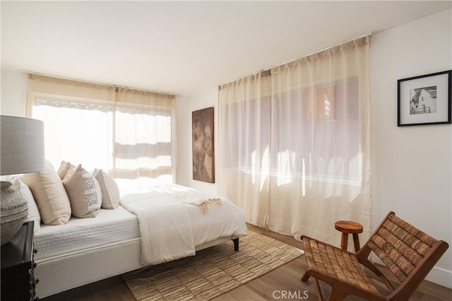 bedroom with wood finished floors