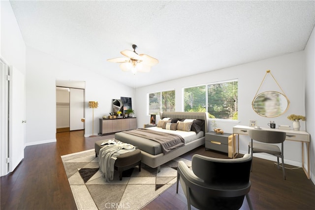 49 Village Loop Rd, Pomona, CA 91766 - bedroom with lofted ceiling, wood finished floors, a textured ceiling, and baseboards