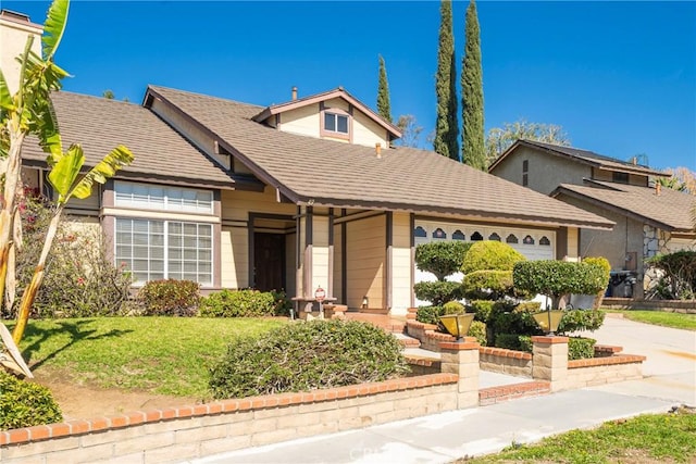 49 Village Loop Rd, Pomona, CA 91766 - view of front of property with concrete driveway, a garage, and a front lawn