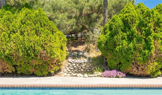 49 Village Loop Rd, Pomona, CA 91766 - outdoor pool featuring a view of trees