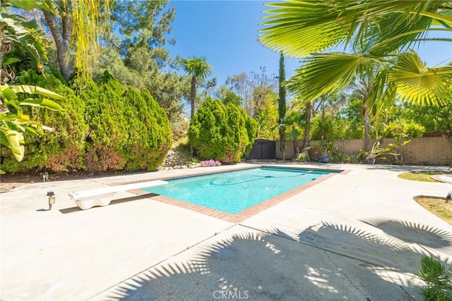 49 Village Loop Rd, Pomona, CA 91766 - view of swimming pool featuring a patio area and a diving board