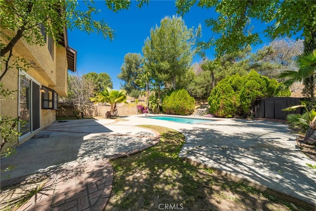 49 Village Loop Rd, Pomona, CA 91766 - view of swimming pool featuring a patio area and a fenced backyard