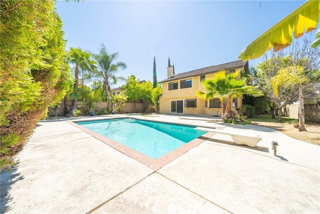 49 Village Loop Rd, Pomona, CA 91766 - view of pool featuring a patio area, a diving board, and a fenced backyard