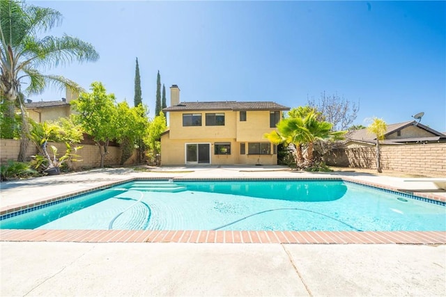 49 Village Loop Rd, Pomona, CA 91766 - view of pool featuring a fenced backyard, a diving board, and a patio