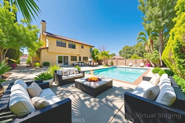 49 Village Loop Rd, Pomona, CA 91766 - view of swimming pool with an outdoor living space with a fire pit, a patio, and a fenced backyard