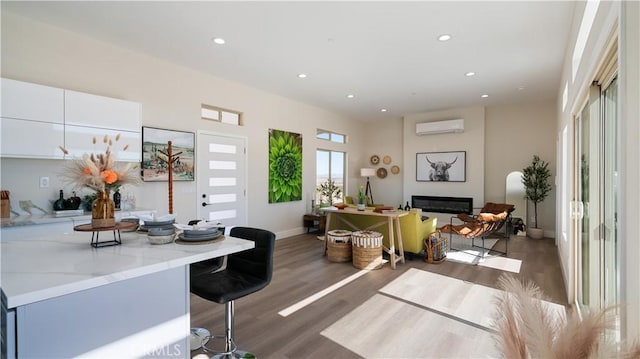 interior space featuring a glass covered fireplace