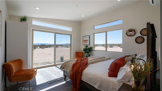 bedroom featuring access to outside, multiple windows, dark wood-type flooring, and recessed lighting