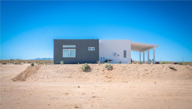 exterior space featuring stucco siding