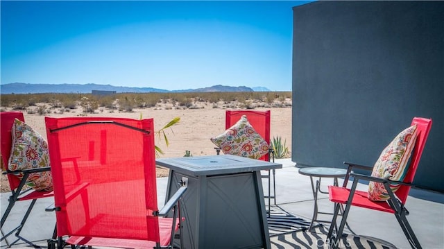 view of patio / terrace with a mountain view