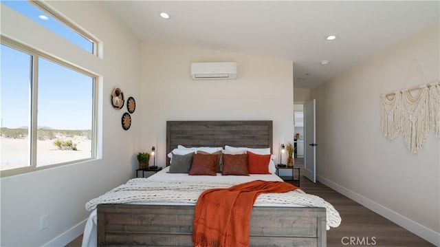 bedroom featuring an AC wall unit, dark wood-type flooring, recessed lighting, and baseboards