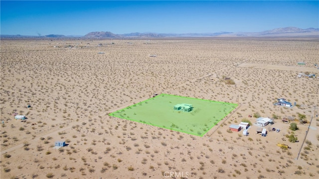 bird's eye view featuring a mountain view and a desert view