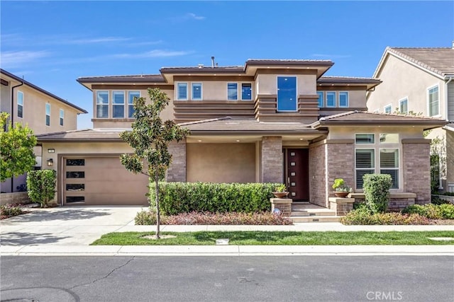 58 Sagan Way, Irvine, CA 92618 - prairie-style home featuring an attached garage, stucco siding, driveway, and a tile roof