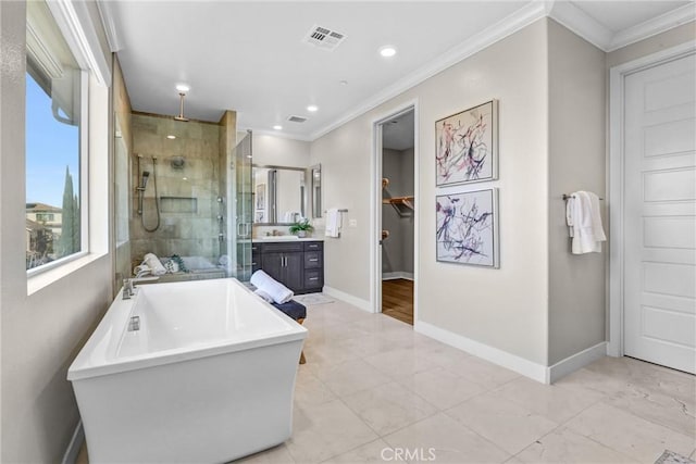 full bathroom featuring vanity, visible vents, a soaking tub, a shower stall, and crown molding