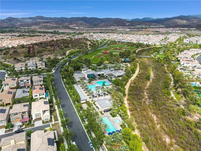 drone / aerial view featuring a residential view and a mountain view