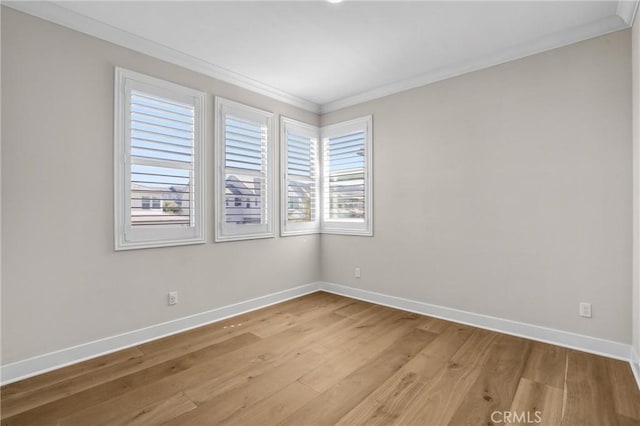 58 Sagan Way, Irvine, CA 92618 - empty room featuring crown molding, baseboards, and light wood-type flooring