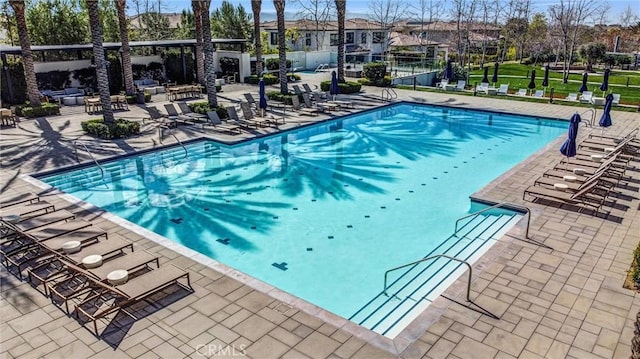 58 Sagan Way, Irvine, CA 92618 - community pool featuring a patio, fence, and a residential view
