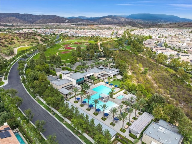 drone / aerial view featuring a residential view and a mountain view