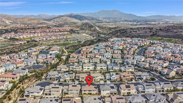 58 Sagan Way, Irvine, CA 92618 - aerial overview of property's location with a mountainous background and nearby suburban area