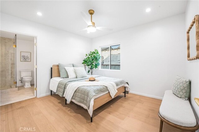 bedroom with recessed lighting, light wood-style flooring, and baseboards