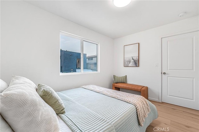 bedroom with light wood-style flooring