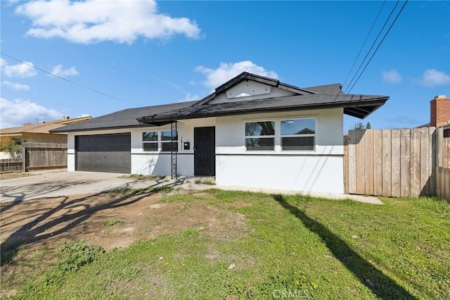 single story home featuring an attached garage, fence, a front yard, stucco siding, and driveway