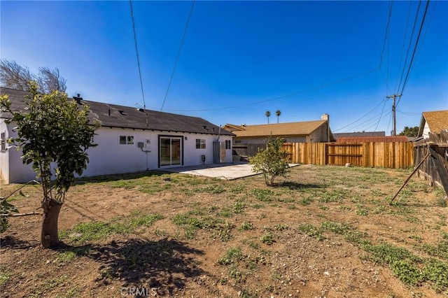 back of property featuring stucco siding, a patio, and fence