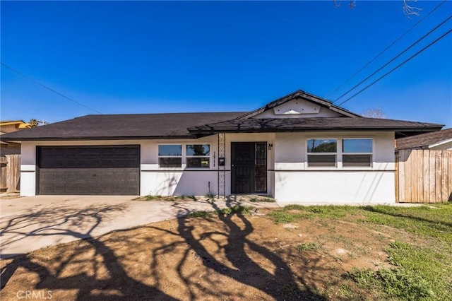 single story home with fence, a garage, driveway, and stucco siding