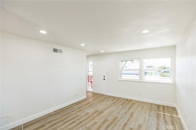 1211 Dena Way, Santa Maria, CA 93454 - empty room with a textured ceiling, light wood-type flooring, baseboards, visible vents, and recessed lighting