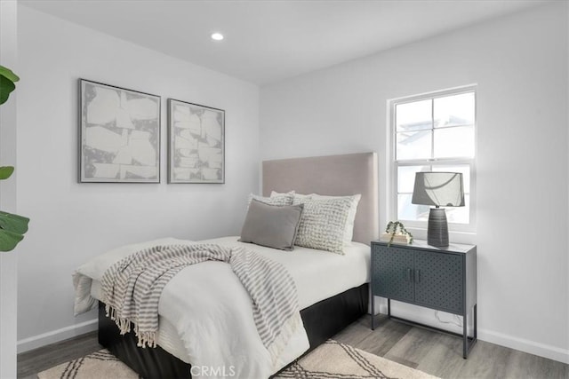 bedroom featuring recessed lighting, baseboards, and wood finished floors