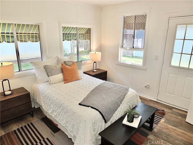 bedroom featuring wood finished floors