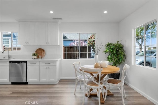 dining area with recessed lighting, baseboards, visible vents, and light wood finished floors