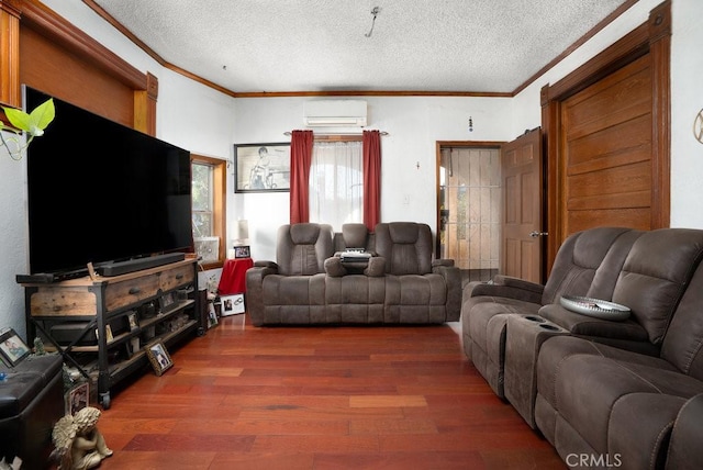 living area featuring a textured ceiling, a wall mounted air conditioner, dark wood finished floors, and crown molding