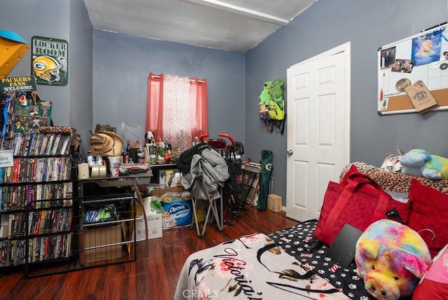 bedroom featuring dark wood finished floors