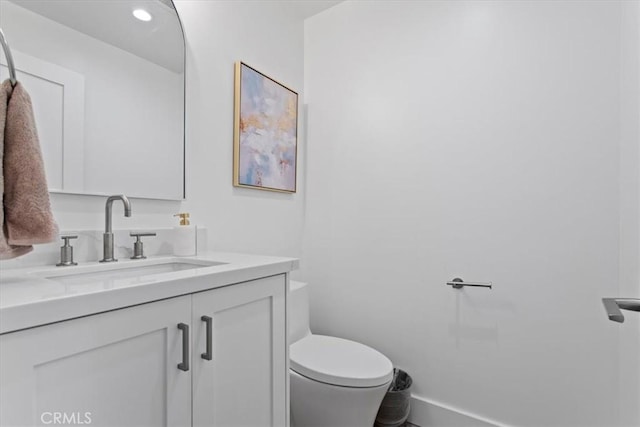 1409 Havenhurst Dr Unit 3, West Hollywood, CA 90046 - bathroom with baseboards, toilet, and vanity