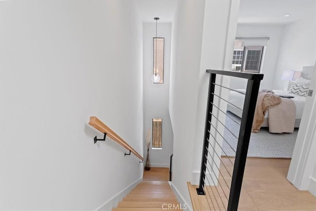 1409 Havenhurst Dr Unit 3, West Hollywood, CA 90046 - staircase featuring baseboards and wood finished floors