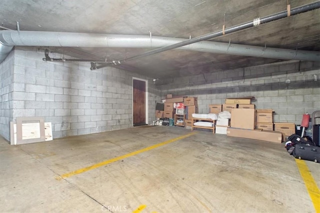 1409 Havenhurst Dr Unit 3, West Hollywood, CA 90046 - parking deck featuring concrete block wall