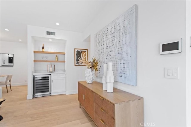 1409 Havenhurst Dr Unit 3, West Hollywood, CA 90046 - bar with visible vents, beverage cooler, light wood-style flooring, recessed lighting, and a bar