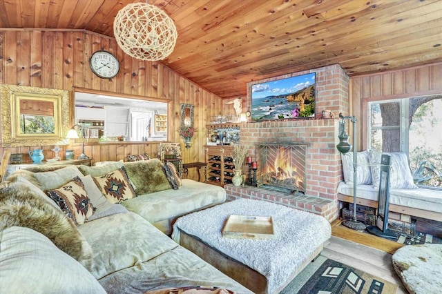 living area with lofted ceiling, a brick fireplace, wood ceiling, and wooden walls