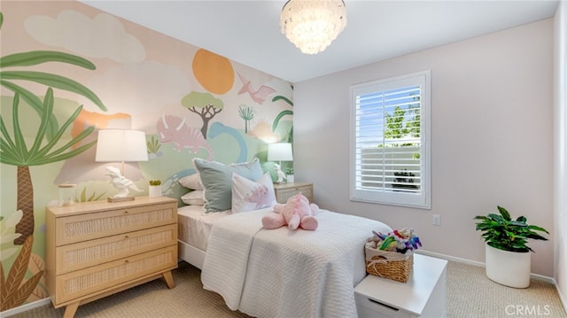 bedroom with carpet floors, a notable chandelier, and baseboards