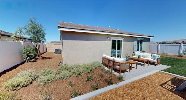 back of house with stucco siding, an outdoor hangout area, a patio area, cooling unit, and a fenced backyard