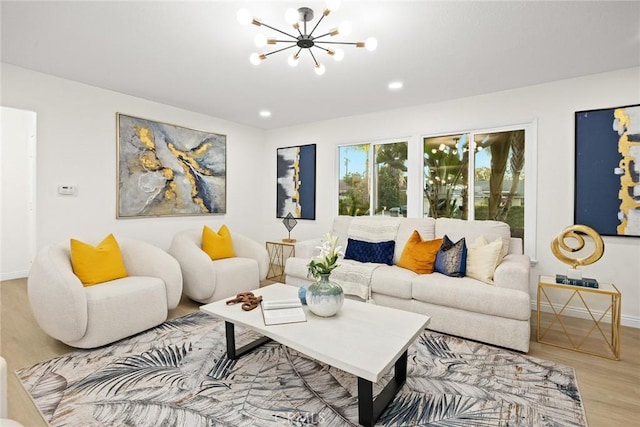 living room featuring an inviting chandelier, baseboards, wood finished floors, and recessed lighting