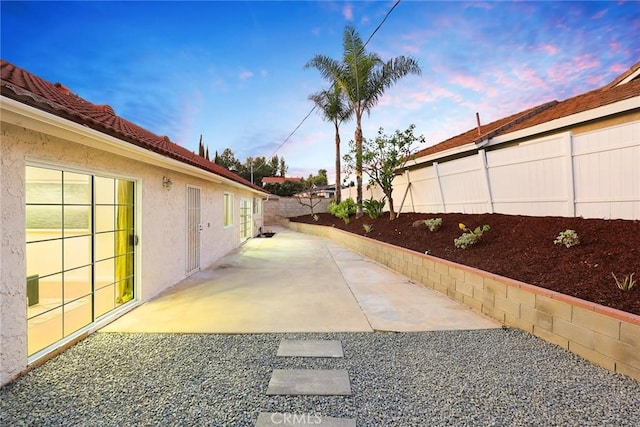 exterior space with a patio area and fence