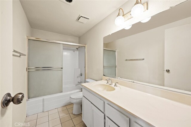 11331 Elliott Ave Unit 21, El Monte, CA 91732 - full bath with toilet, tile patterned floors, vanity, and shower / bath combination with glass door