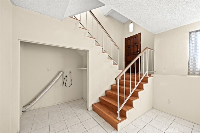 11331 Elliott Ave Unit 21, El Monte, CA 91732 - stairway with a textured ceiling and tile patterned flooring